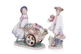 TWO LLADRO PORCELAIN FIGURES OF GIRLS WITH FLOWERS