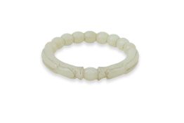 A CELADON JADE DRAGON BANGLE