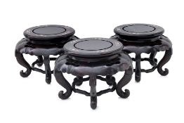 A SET OF THREE MOTHER OF PEARL INLAID HARDWOOD STANDS