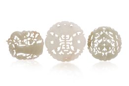 A GROUP OF THREE RETICULATED JADE PLAQUES