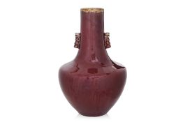 A LARGE 'SANG DE BOEUF' BOTTLE VASE