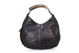 YVES SAINT LAURENT - A BLACK LEATHER 'MOMBASA' HANDBAG WITH ANTLER HANDLE