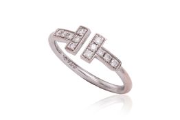 A 'T WIRE' DIAMOND RING BY TIFFANY & CO.