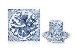 A BLUE AND WHITE 'DRAGON' TILE AND A GRINDER