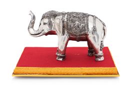 A WHITE METAL MODEL OF AN ELEPHANT