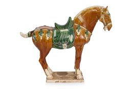 A SANCAI GLAZED MODEL OF A HORSE