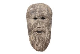 A LARGE CARVED HARDWOOD MASK