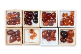 A GROUP OF UNMOUNTED CABOCHON GARNETS (55)