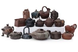 A GROUP OF 16 YIXING ZISHA TEAPOTS