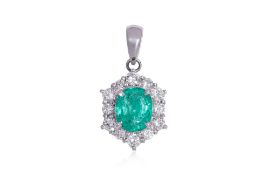 AN EMERALD AND DIAMOND 'HALO' PENDANT