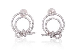A PAIR OF DIAMOND SET CIRCULAR 'KNOT' EARRINGS
