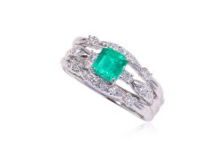 A COLOMBIAN EMERALD AND DIAMOND RING BY TASAKI