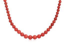 A GRADUATED CORAL BEAD STRAND NECKLACE