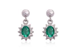 A PAIR OF EMERALD AND DIAMOND STUD EARRINGS