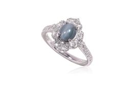 A CAT'S EYE ALEXANDRITE AND DIAMOND RING