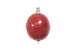 A RED CORAL CABOCHON AND DIAMOND PENDANT