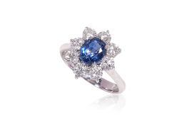 A SAPPHIRE AND DIAMOND 'HALO' RING