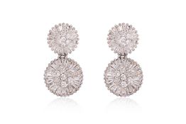 A PAIR OF DIAMOND 'EIGHT' STUD EARRINGS