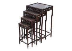 A NEST OF FOUR HARDWOOD SIDE TABLES