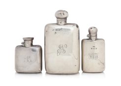 A GROUP OF THREE ENGLISH STERLING SILVER HIP FLASKS