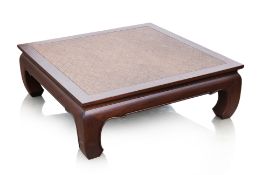 A SQUARE TEAK COFFEE TABLE WITH RATTAN PANEL TOP