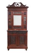 A CARVED TEAK CABINET