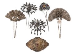 A SILVER BELT BUCKLE AND A GROUP OF HAIRPINS