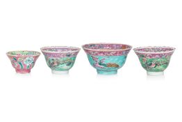 A GROUP OF FOUR FAMILLE ROSE TEA BOWLS