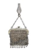 A SILVER BELT CLIP AND A MESH PURSE