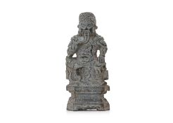 A CARVED GREY STONE FIGURE OF GUANDI