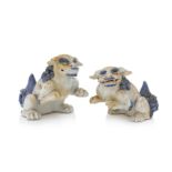 A PAIR OF JAPANESE HIRADO MIKAWACHI BLUE AND WHITE LION FIGURES
