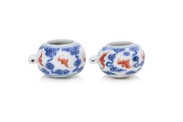TWO UNDERGLAZE BLUE AND IRON RED 'BAT AND CLOUDS' BIRD FEEDERS