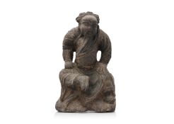A CARVED SANDSTONE MODEL OF GUANDI
