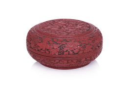 A FINELY CARVED CINNABAR LACQUER CIRCULAR BOX AND COVER