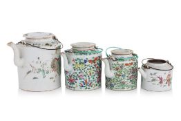 A GROUP OF FOUR FAMILLE ROSE PORCELAIN TEAPOTS