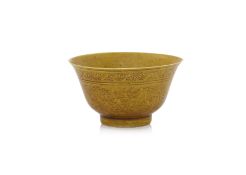 A DRAGON DECORATED YELLOW-GLAZED TEA BOWL
