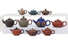 A GROUP OF TEN YIXING TEAPOTS