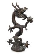 A LARGE METALWARE MODEL OF A DRAGON AND PEARL