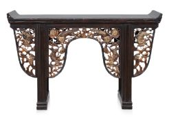 A CARVED AND PARCEL GILT CONSOLE TABLE