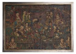 A LARGE POLYCHROME CARVED AND LACQUERED BUDDHIST WOOD PANEL