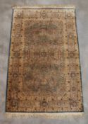 A CREAM GROUND SILK RUG (123 x 76CM)