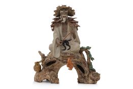 A SHIWAN POTTERY MODEL OF A FISHERMAN