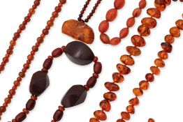 A GROUP OF FIVE AMBER AND BAKELITE NECKLACES