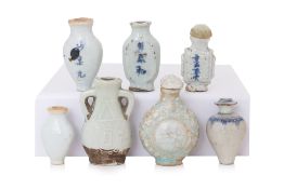 A GROUP OF SEVEN MINIATURE PORCELAIN BOTTLES