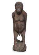 A LIFE-SIZE CARVED WOOD MODEL OF AN ORANGUTAN