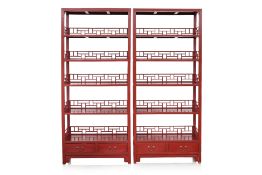 A PAIR OF RED LACQUER OPEN BOOKCASES
