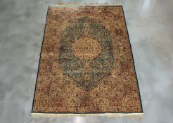 A PERSIAN BLUE GROUND MEDALLION SILK RUG (183 x 125CM)