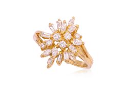 A HIGH KARAT GOLD DIAMOND CLUSTER RING