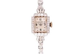 A MOVADO DIAMOND SET PLATINUM COCKTAIL WATCH
