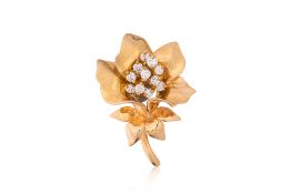 A HIGH KARAT GOLD DIAMOND 'FLOWER' PENDANT